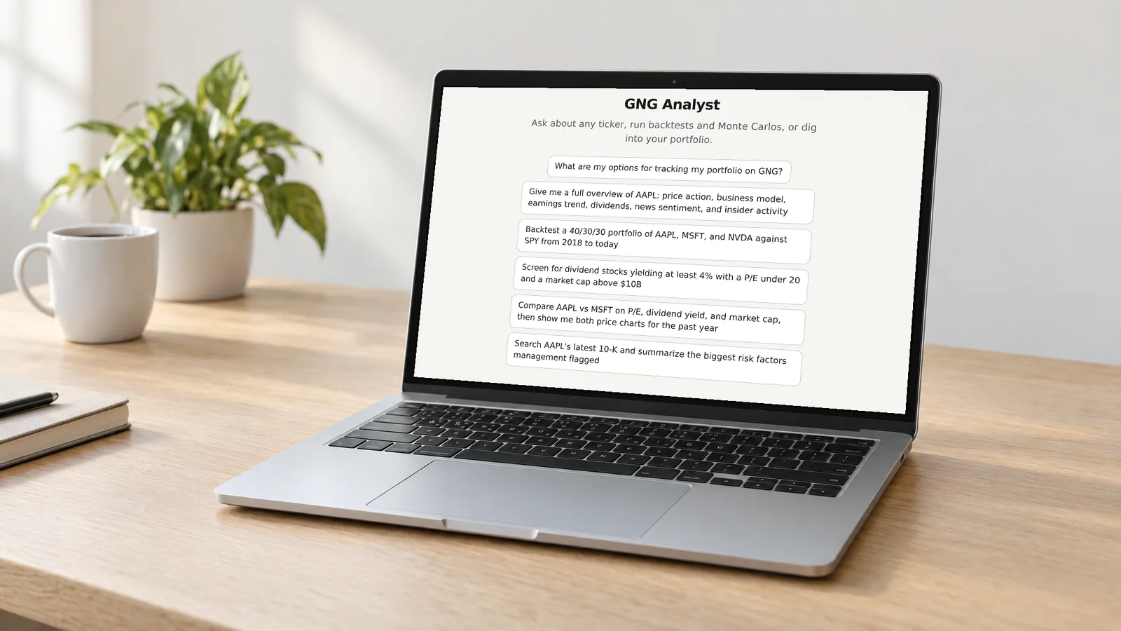 Laptop on a desk showing the GNG Analyst welcome screen and six suggested research prompts